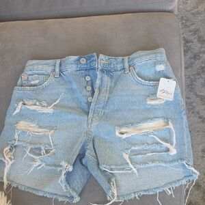 Ftee People Maggie Mid Rise Distressed Denim Light Blue Short. Size 27